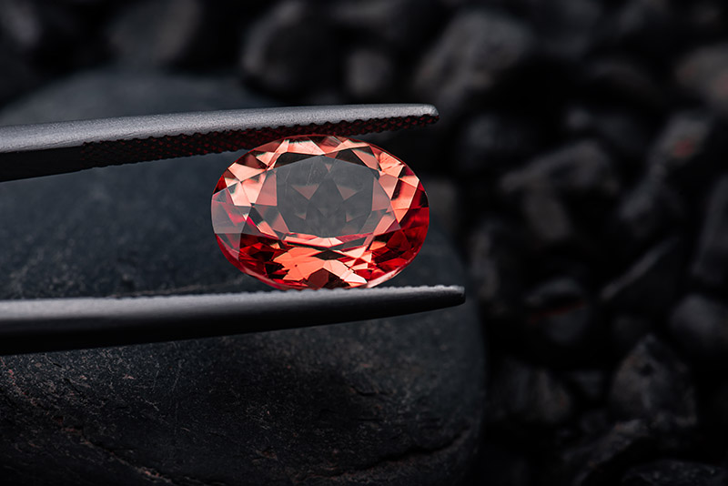 Oval red garnet gemstone - color changing gemstones