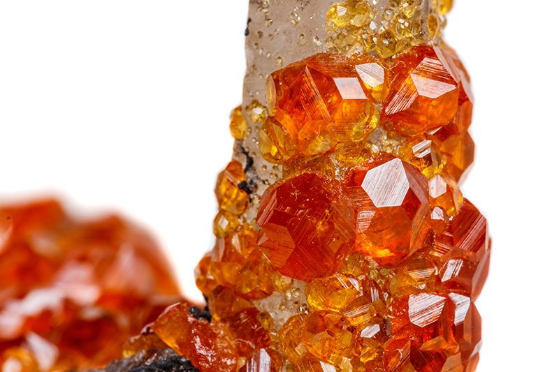 Macro mineral stone Spessartine, an orange, red garnet with quartz
