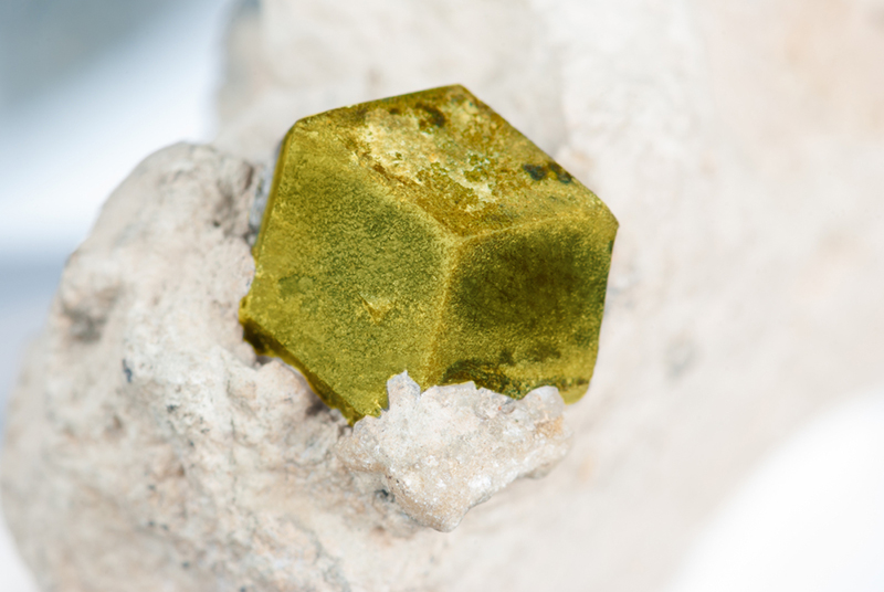 Single crystal of natural green gemstone Garnet Andradite