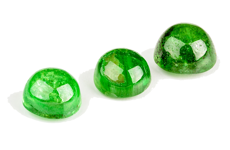 Three Tsavorite garnet cabochons