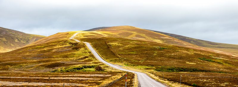 A scenic highway in autumn in Cairngorms national park, Scotland