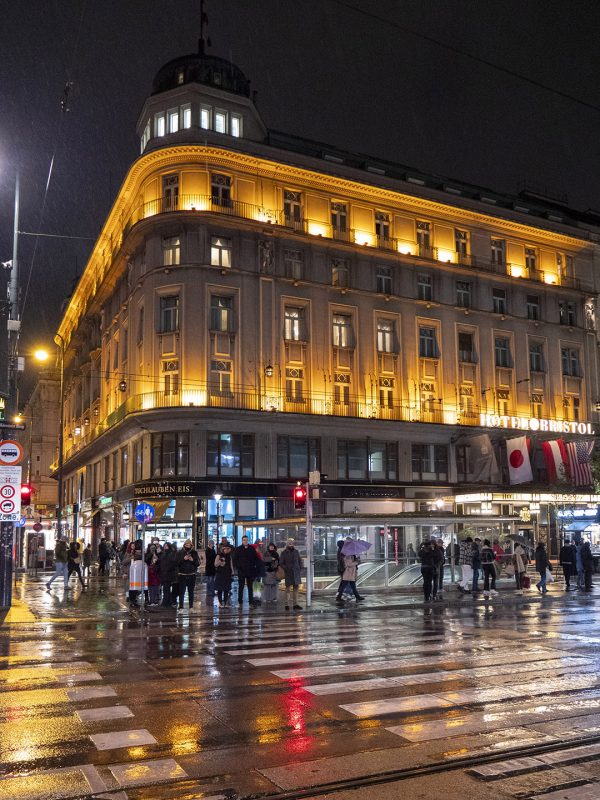 The exterior of Hotel Bristol in Vienna by night
