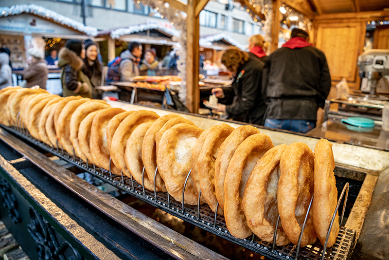 Budapest Christmas Market traditional street food called Langos doughnut