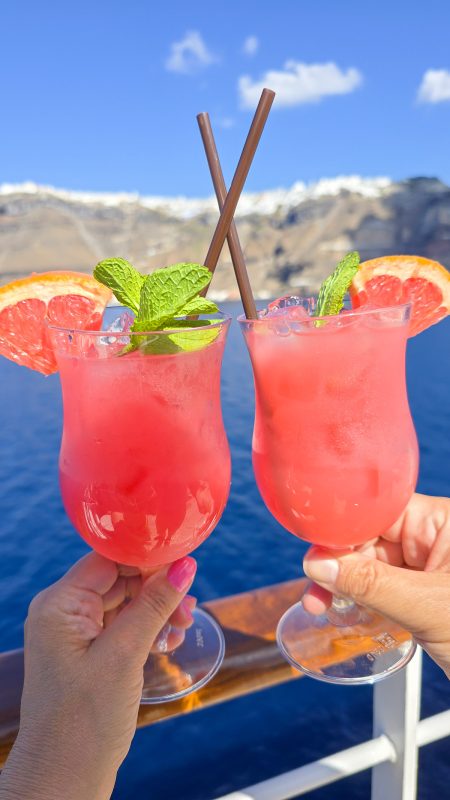 Cocktails with Santorini behind