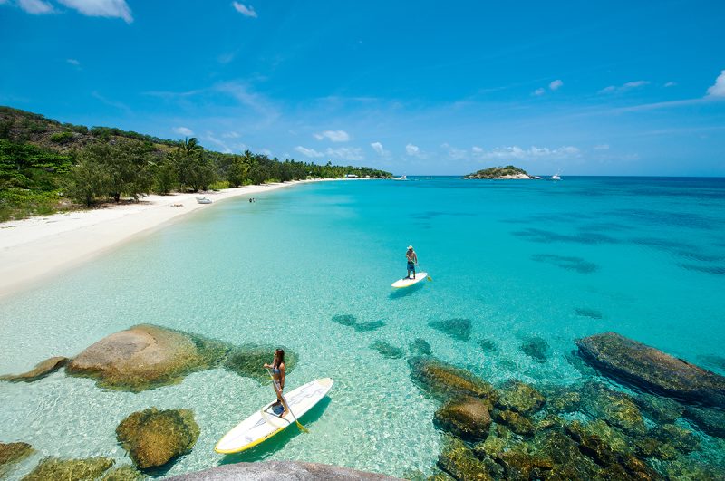 paddleboarding in the clear water