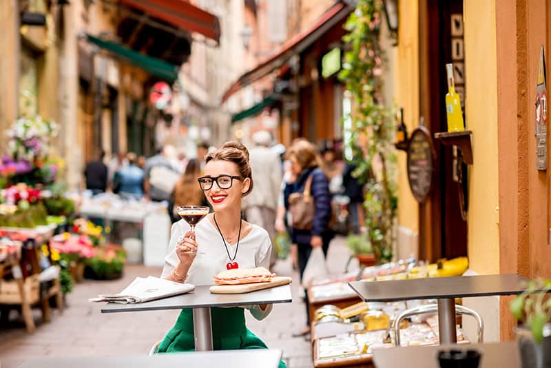 Shakerato coffee and mortadella panini at a Bologna cafe terrace