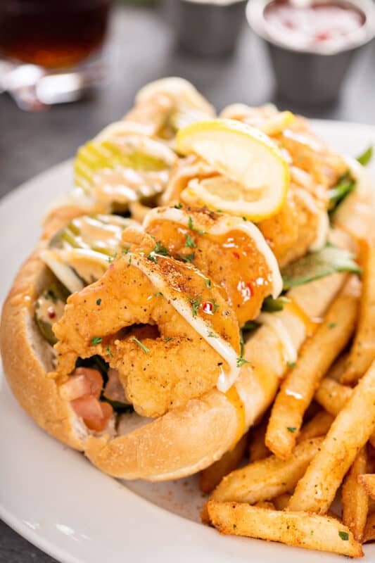 Shrimp po boy sandwich with fries