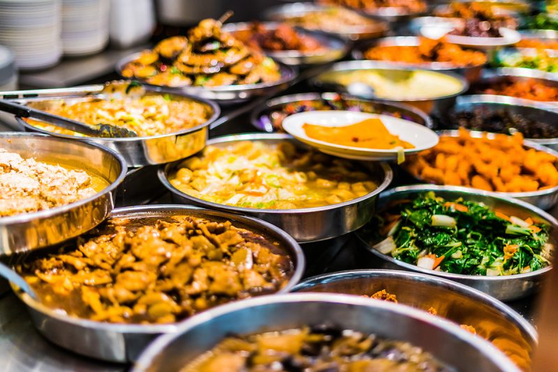 Traditional Asian dishes at a food court in Singapore