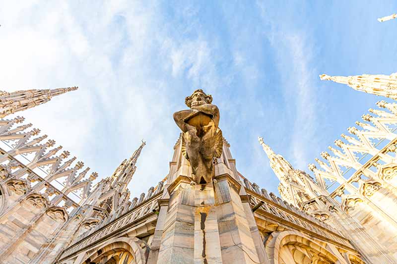 Roof of Milan Cathedral with Gothic spires and white marble statues
